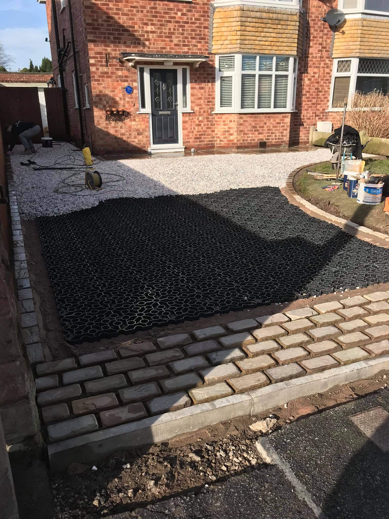 Stabilised gravel driveways are a very cost effective option for any driveway - using the correct installation method and grid choice they are a very hard wearing and completely permeable option that costs a fraction of other surfaces.
These driveways are ideal for budget driveways, if a large area needs to be covered or even to break up a driveway design in conjunction with another materials such as block paving.